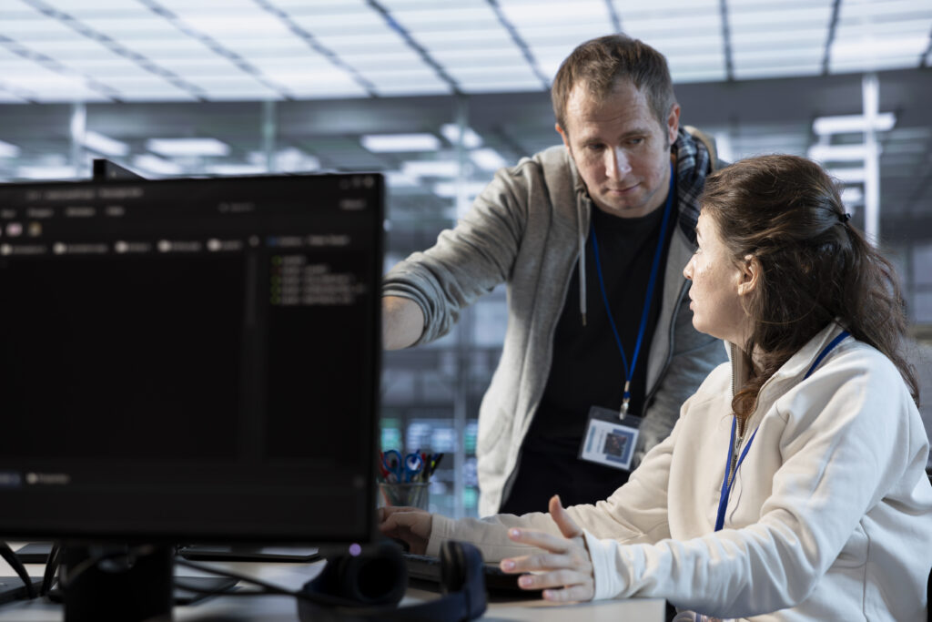 it engineers in server farm brainstorming ways to repair equipment